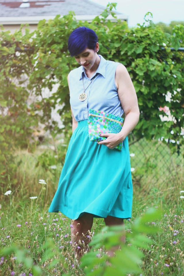 Outfit: Sleeveless chambray blouse, teal skirt, printed vintage clutch, purple pixie cut