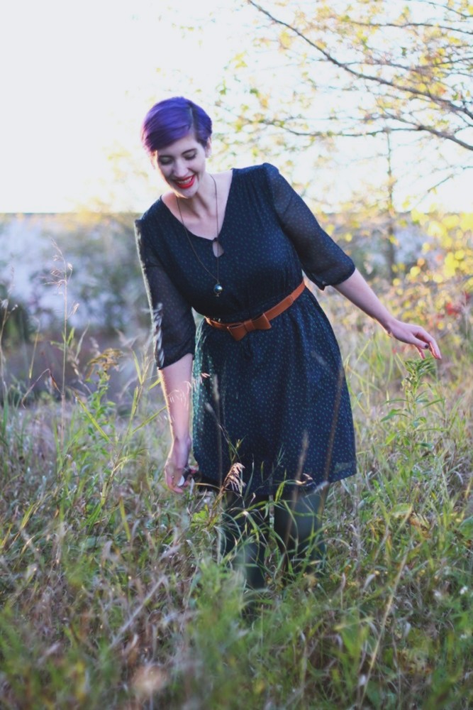 Wearing ALL The Fall Colors! | The Outfit Repeater Outfit: Navy blue dress, forest green tights, cognac bow belt, red lipstick, purple pixie cut