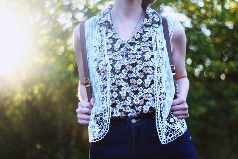 1970s Inspired Outfit: Floral blouse, white lace vest, high waisted dark wash denim,