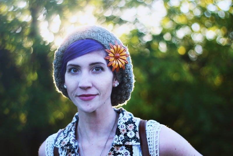 1970s Inspired Outfit: Floral blouse, slouchy green hat, vintage orange flower brooch, purple hair