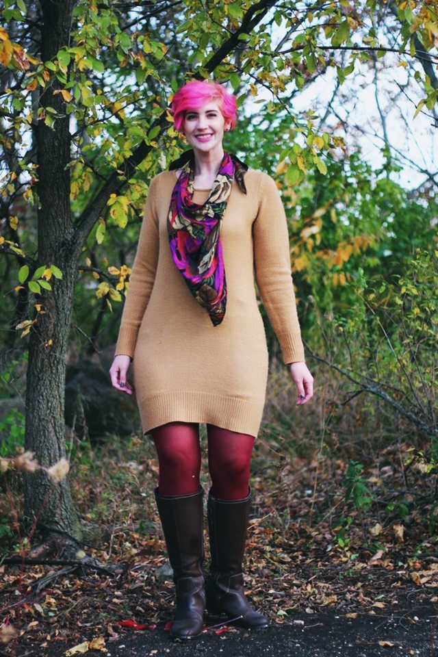 Outfit: camel colored thrifted sweater dress, burgundy maroon tights, dark brown knee high boots, purple multi-colored scarf, curly bright pink pixie cut short hair