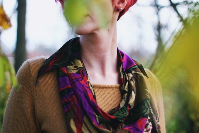 Outfit: camel colored thrifted sweater dress, burgundy maroon tights, dark brown knee high boots, purple multi-colored scarf, curly bright pink pixie cut short hair