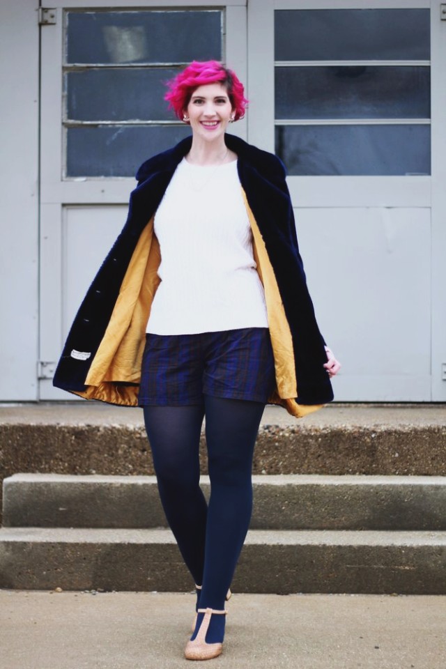 Outfit: furry blue coat, oversized white sweater, high waisted plaid shorts, navy blue tights, beige t-strap high heels, curly pink hair