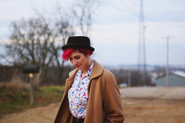 Modern Musings and '80s Style | The Outfit Repeater Outfit: colorful printed shirt, high waisted shorts, purple tights, pork pie hat, pink hair, black flats, vintage camel colored coat