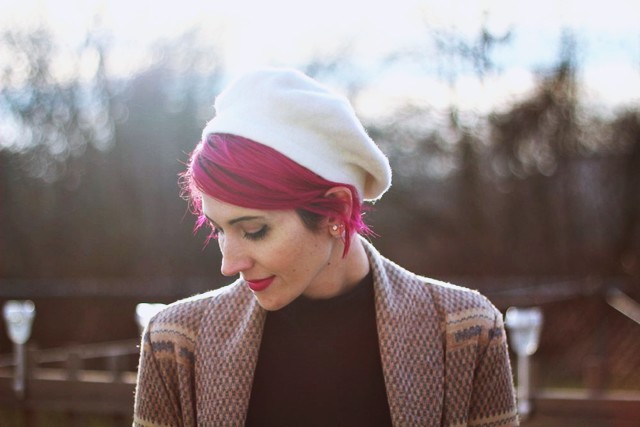 outfit: black high neck early 2000's dress, vintage patterned cardigan, bright magenta short hair, white vintage beret thrifted