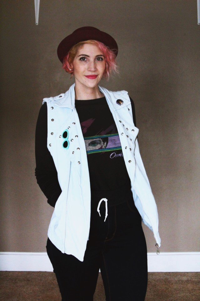 High waisted jeans, vintage sweatshirt, denim studded vest, black heeled boots, purple bowler hat