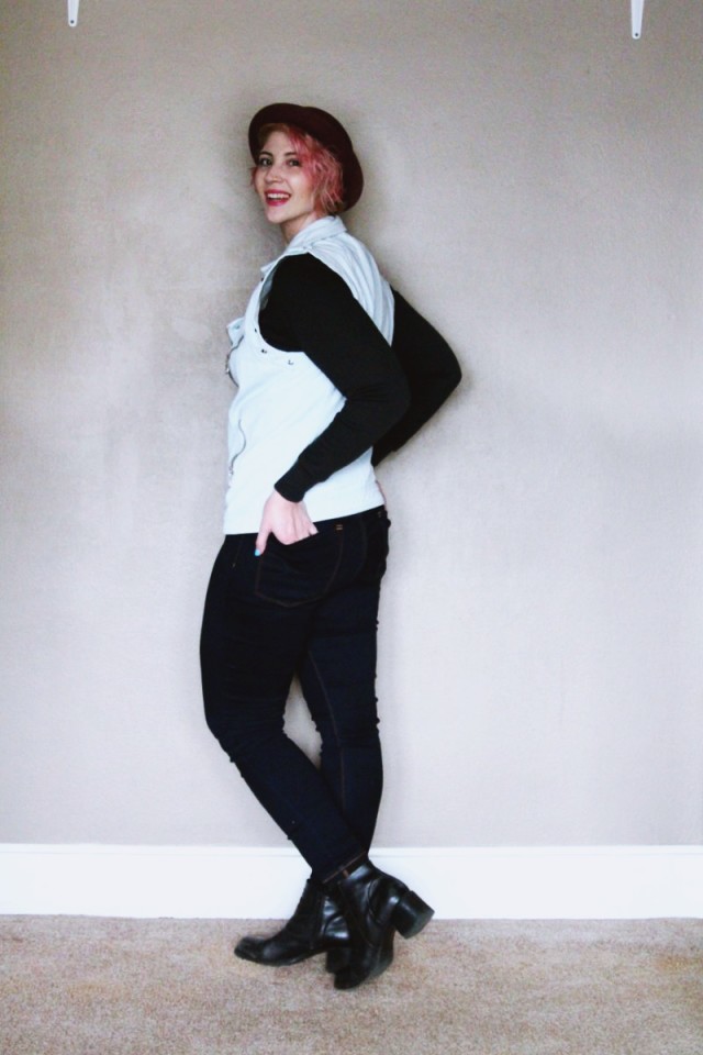 High waisted jeans, vintage sweatshirt, denim studded vest, black heeled boots, purple bowler hat