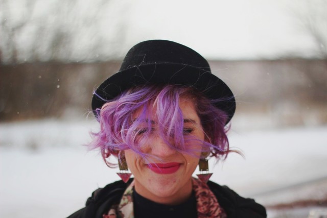 Pretty In Pink inspired volcanic ensemble: black pork pie hat, 80s-era statement earrings, ultra violet manic panic mermaid hair