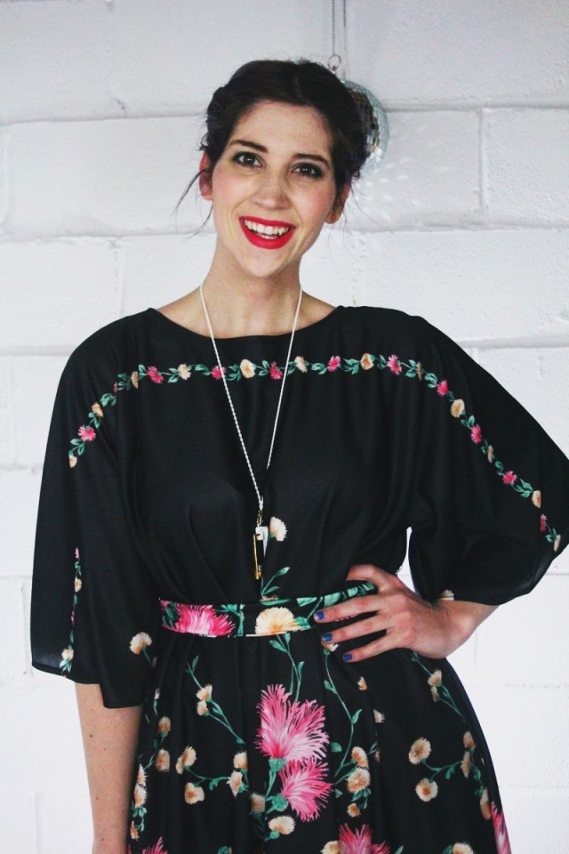 1970's inspired outfit: black floral maxi dress, yellow stacked heels, hot pink lipstick, vintage Monet necklace, disco ball