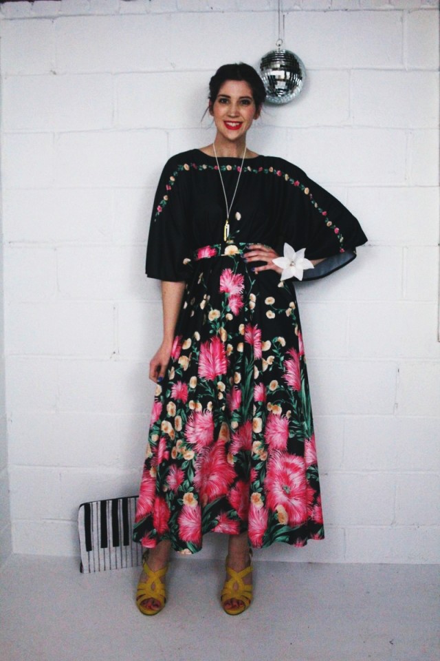 1970's inspired outfit: black floral maxi dress, yellow stacked heels, hot pink lipstick, vintage Monet necklace, disco ball