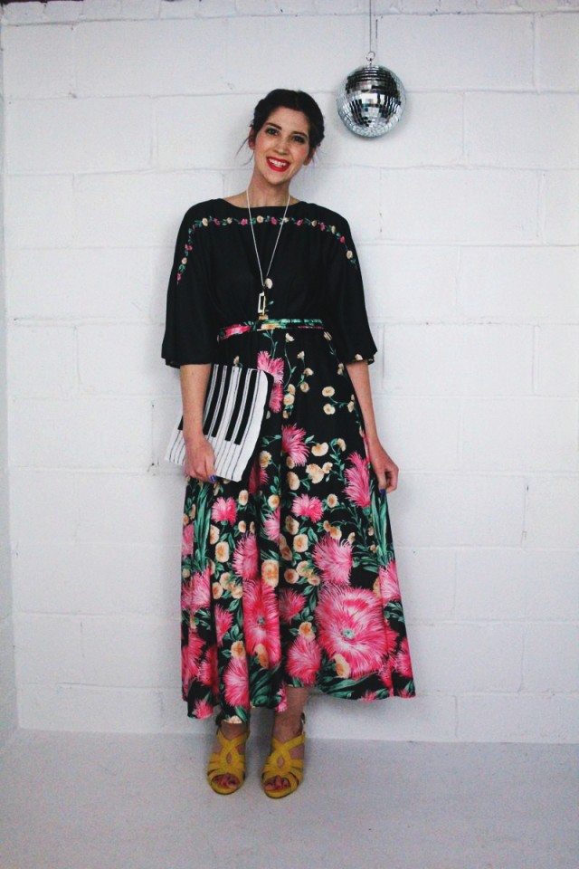 1970's inspired outfit: black floral maxi dress, yellow stacked heels, hot pink lipstick, vintage Monet necklace, disco ball