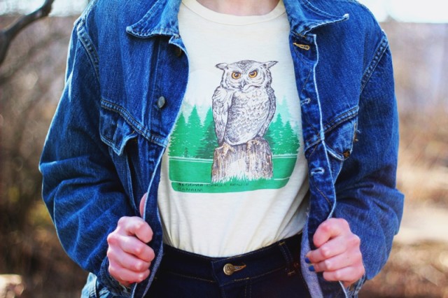 1970's inspired outfit: High waisted flared denim pants, jean jacket, vintage yellow owl graphic tee, oversized sunglasses, heeled boots, Seventeen magazine