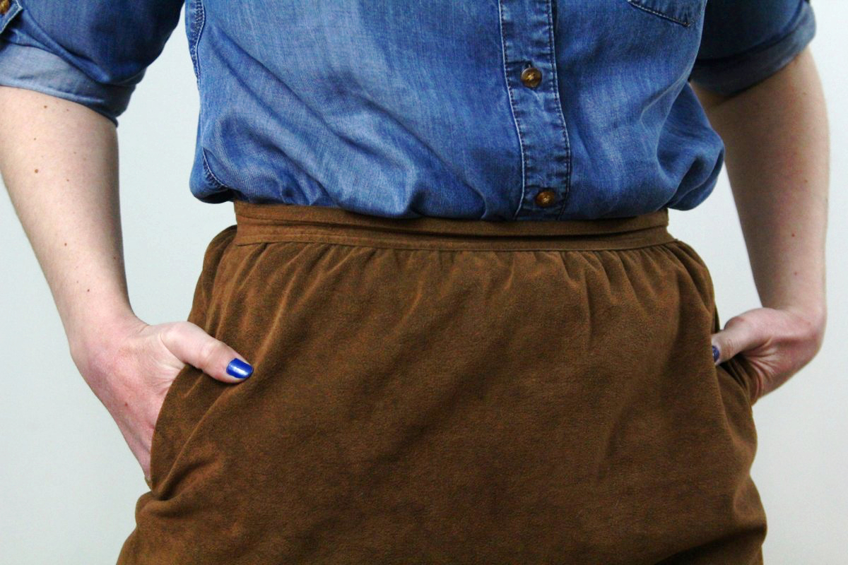 Outfit details: chambray button up and suede cognac skirt