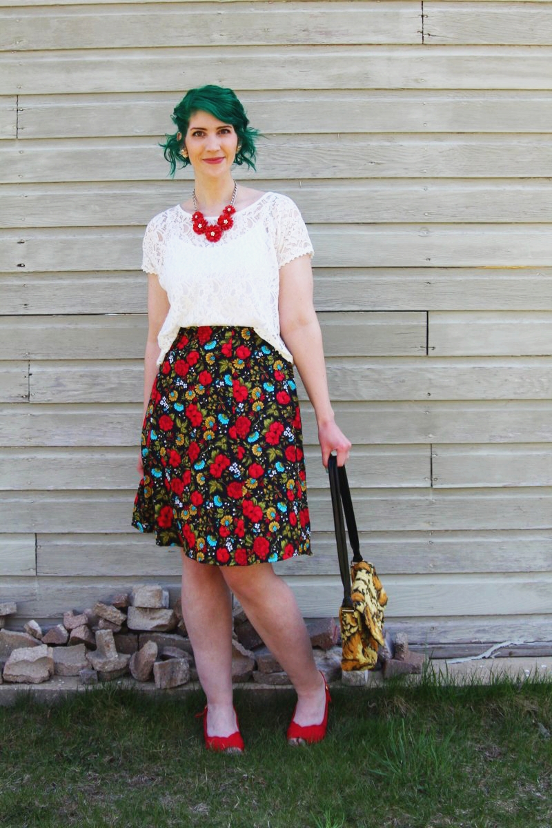 Spring style outfit: Target white lace crop top, vintage thrifted red floral skirt, thrift yellow carpet bag, red flower necklace, Punky Colours green hair, vintage red kitten heels pattern mixing