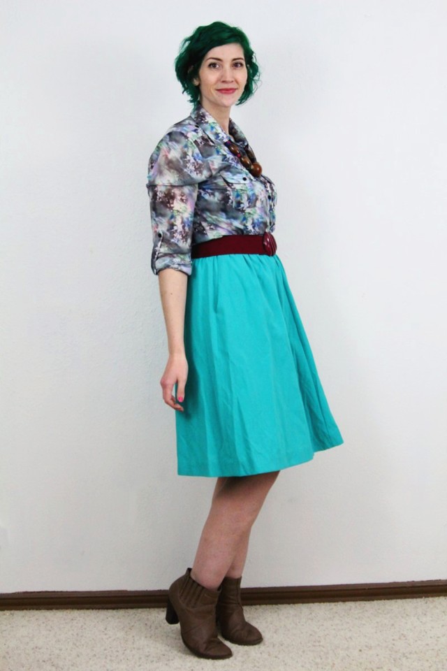 Spring outfit: teal skirt, printed top, maroon belt, chunky necklace, pine green hair, tan booties