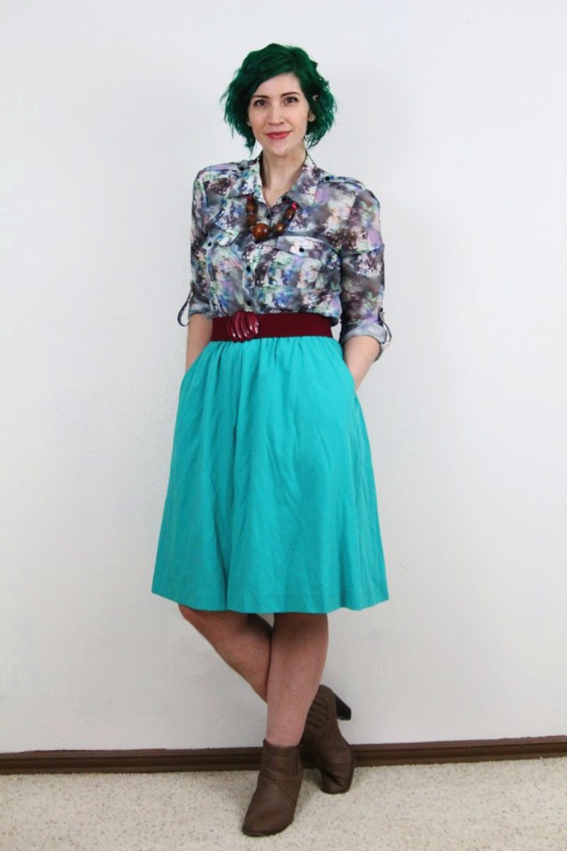 Spring outfit: teal skirt, printed top, maroon belt, chunky necklace, pine green hair, tan booties