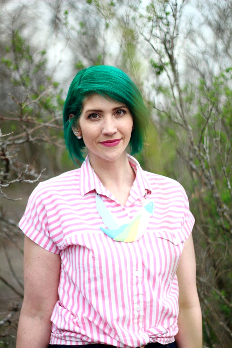 Outfit: pink striped button up, parrot shaped statement necklace, green hair