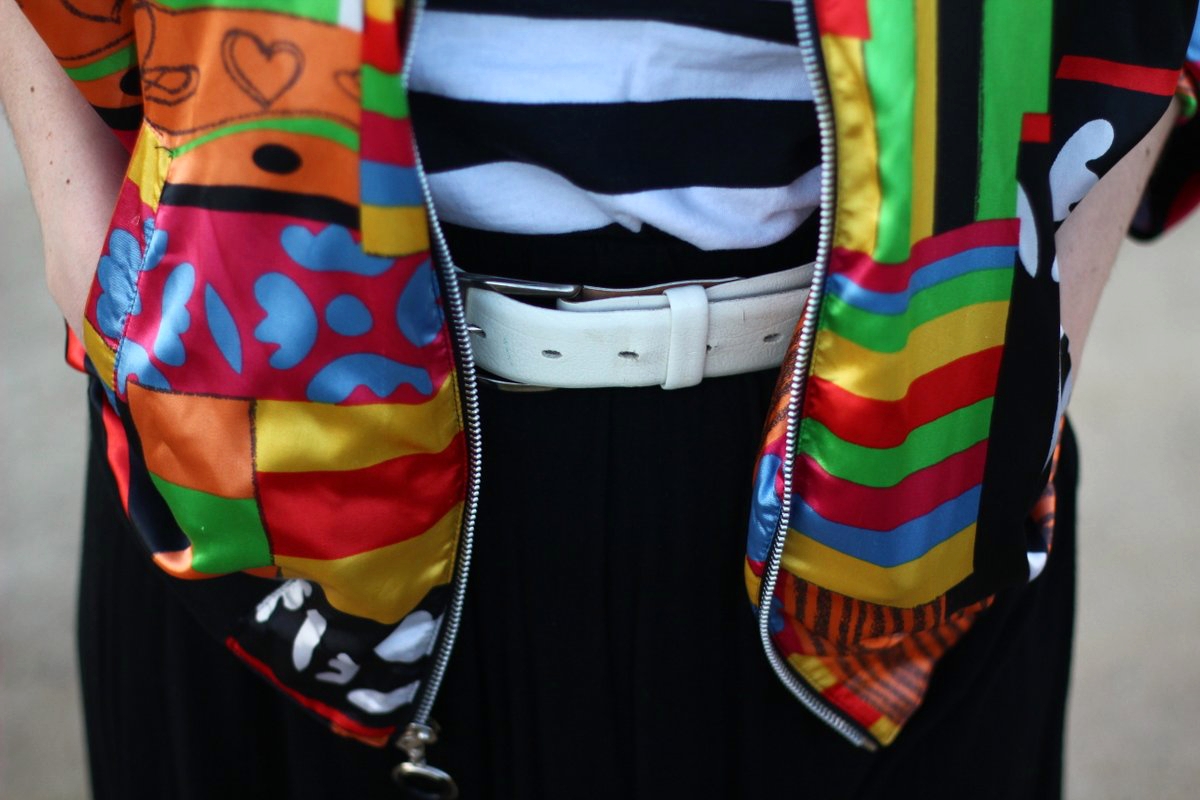 Outfit details: striped shirt, colorful bomber jacket, wide wide belt, black skirt