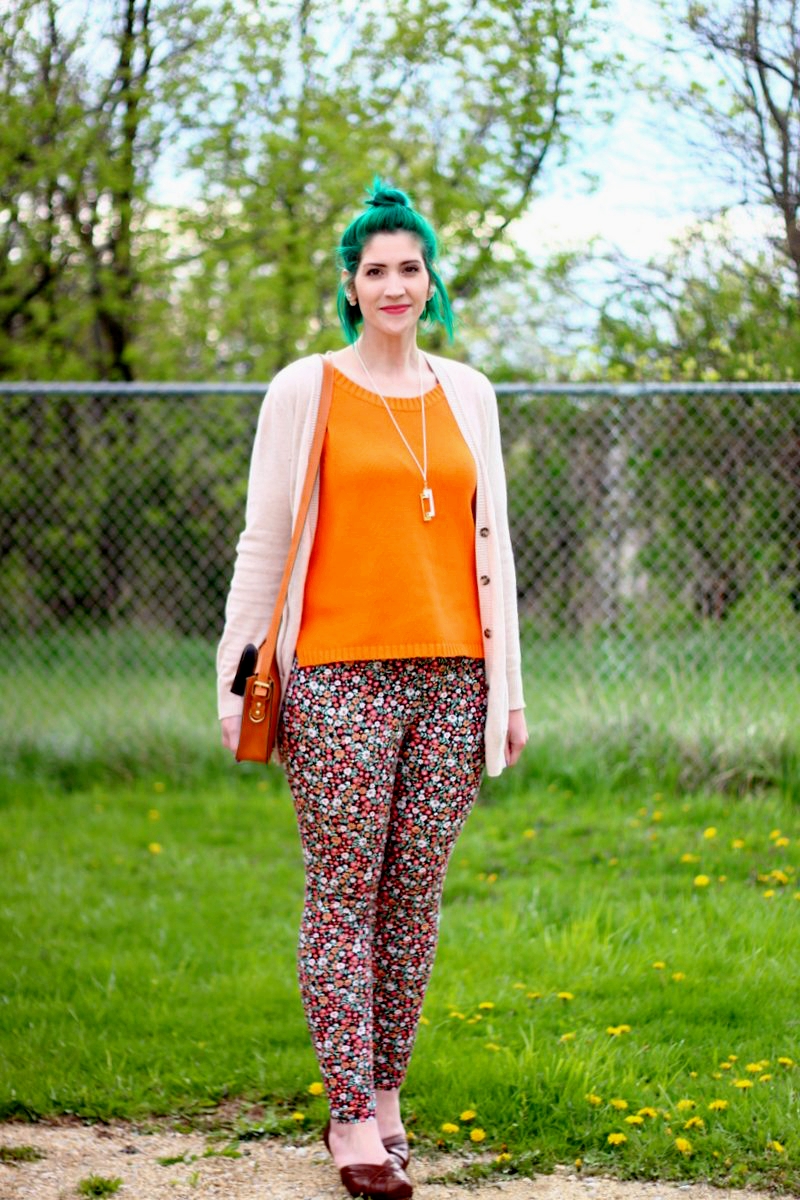 How Thrifted Shoes Put a Spring In My Step | theoutfitrepeater.com Outfit: vintage orange tank top, beige cardigan, green mini bun, thrifted floral pants, brown high heels, gold necklace