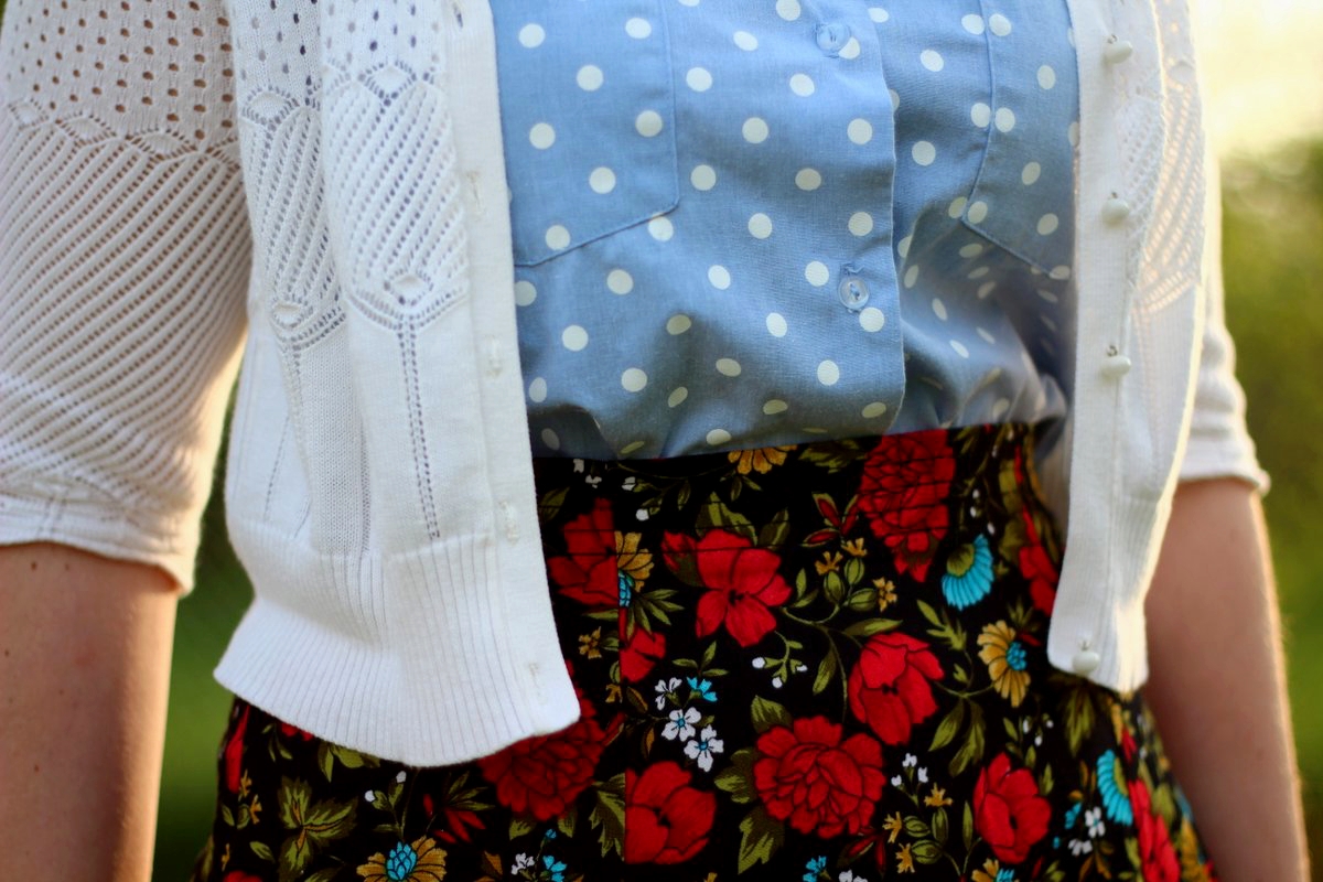 Outfit details: polka dot chambray top, black floral skirt, white cardigan