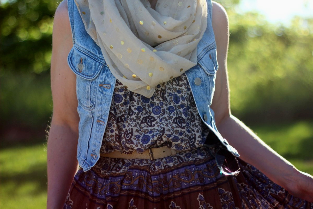 Outfit details: patterned summer dress, light wash denim vest, gold polka dot scarf, beige belt