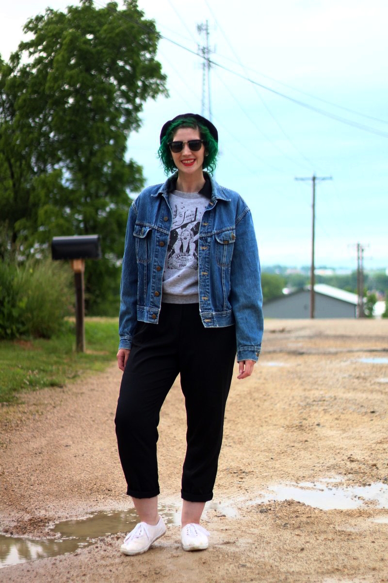 Ferris Bueller's Day Off movie inspired outfit: thrifted black jumpsuit, gray 1986 sleeveless sweatshirt, vintage denim jacket, black beret, black sunglasses, red lipstick, green hair, white sneakers