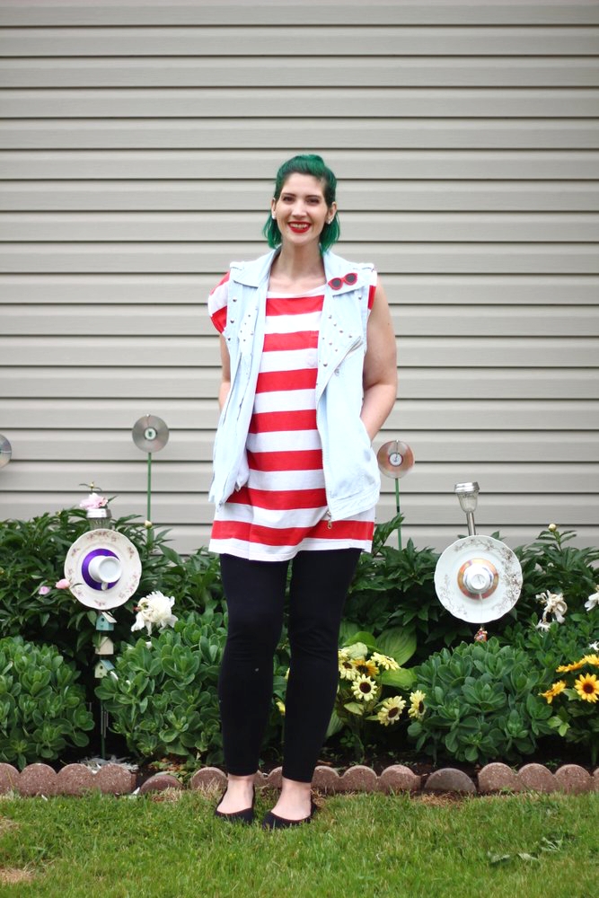 Outfit: red and white striped tunic, denim studded vest, vintage red sunglasses pin, green hair, red lipstick, black leggings, black flats