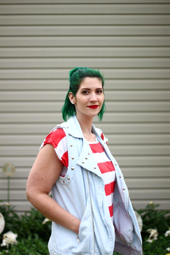 Outfit: red and white striped tunic, denim studded vest, vintage red sunglasses pin, green hair, red lipstick