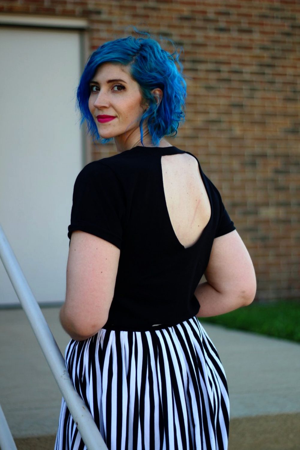 Outfit: Black cutout t-shirt, black and white striped skirt, blue hair, pink lipstick