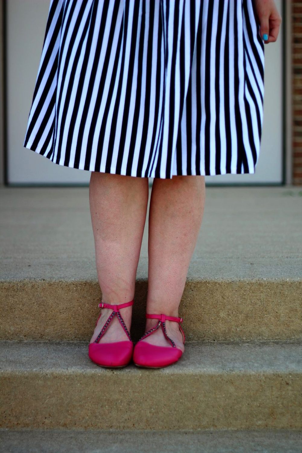 Outfit details: black and white striped skirt, pink flats.