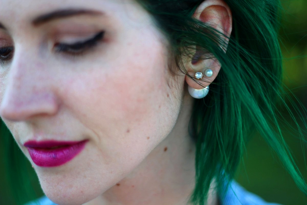 face: green hair, pearl back earring, purple lipstick