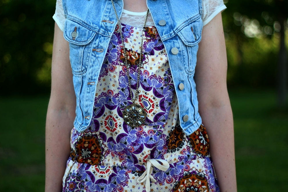 outfit details: purple boho romper overalls, light wash denim vest, white lace tee, gold oversized medallion necklace