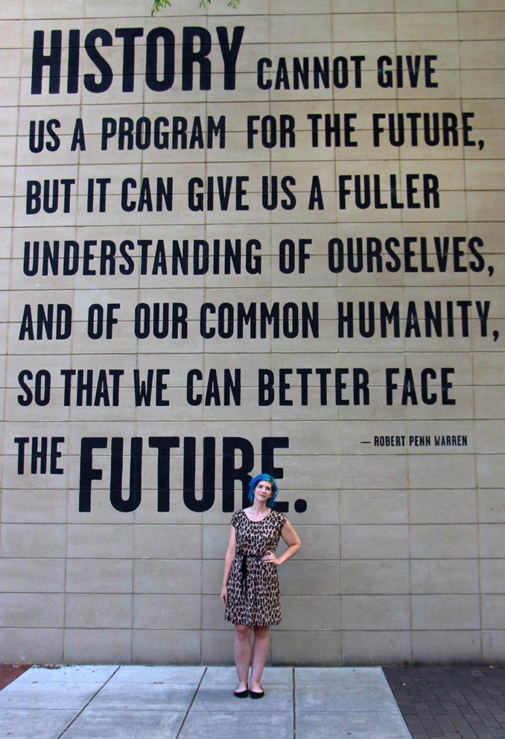 What I Wore On My Summer Vacation | theoutfitrepeater.com Outfit: leopard print dress, sky blue curly hair, black flats, Tennessee Aquarium quote wall