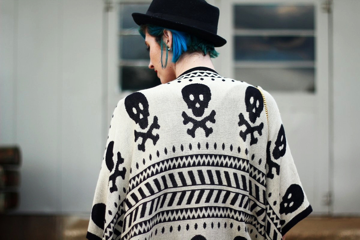 Outfit: Wearing a cardigan with a skull pattern