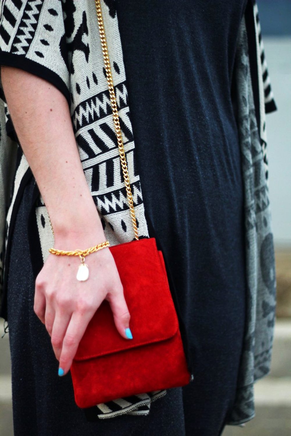 Outfit: Wearing a cardigan with a skull pattern, thrifted gray t-shirt dress, red purse