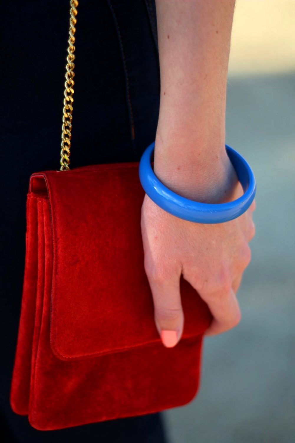 Outfit details: vintage small red suede purse with gold chain strap and blue 1980s bangle