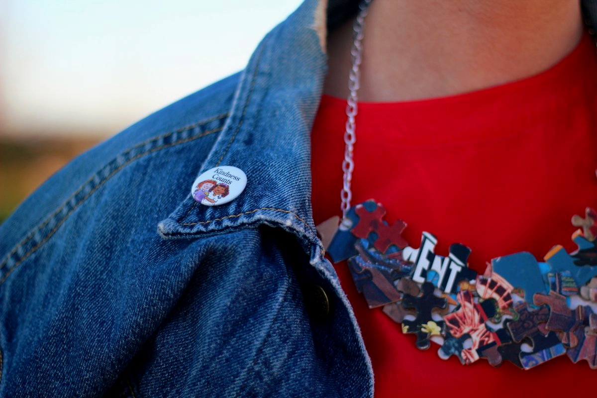 Outfit details: American Girl grin pin on vintage denim jacket, red blouse, DIY puzzle piece necklace