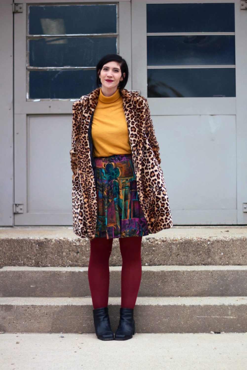 How A Leopard Print Coat Can Change Your Life | theoutfitrepeater.com Outfit: Leopard print coat, mustard yellow turtleneck, multi colored skirt, maroon tights, black booties