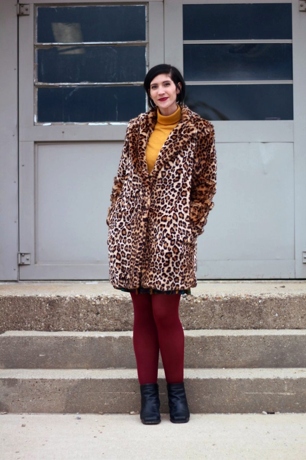 How A Leopard Print Coat Can Change Your Life | theoutfitrepeater.com Outfit: Leopard print coat, mustard yellow turtleneck, multi colored skirt, maroon tights, black booties