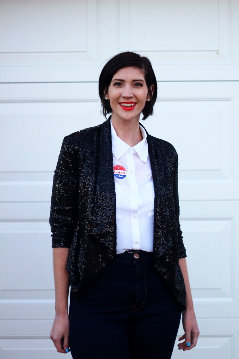 Election day outfit: white button up, red lipstick, I Voted sticker, black sequined blazer, high waisted jeans