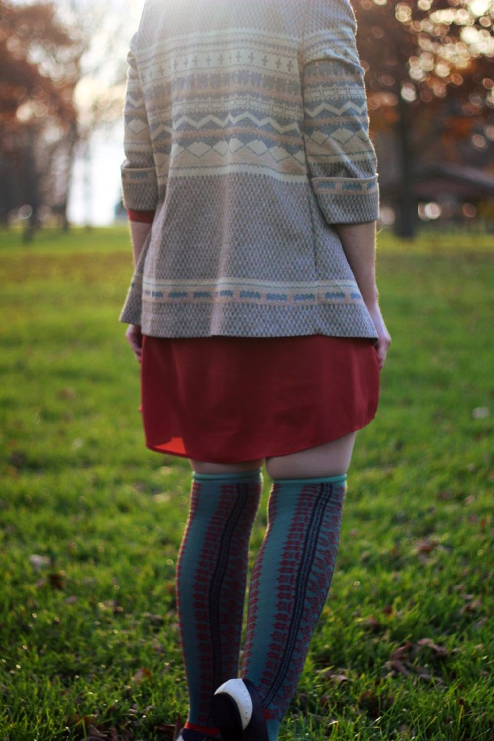 Outfit details: Orange dress, patterned cardigan, otk colorful socks