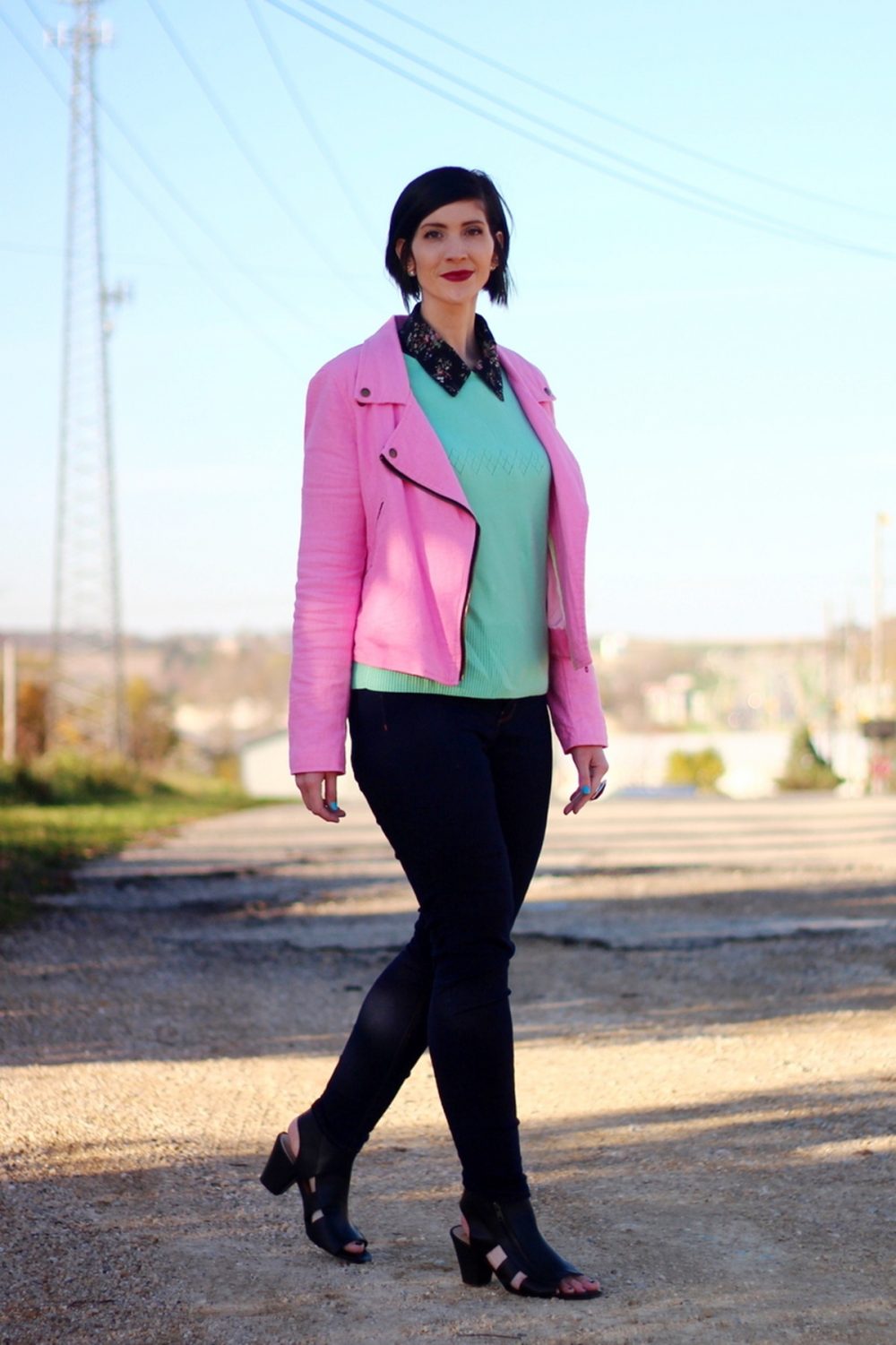 Outfit: Floral collar top, mint green sweater, bright pink jacket, dark lipstick, high waisted dark wash jeans, black cut out high heels