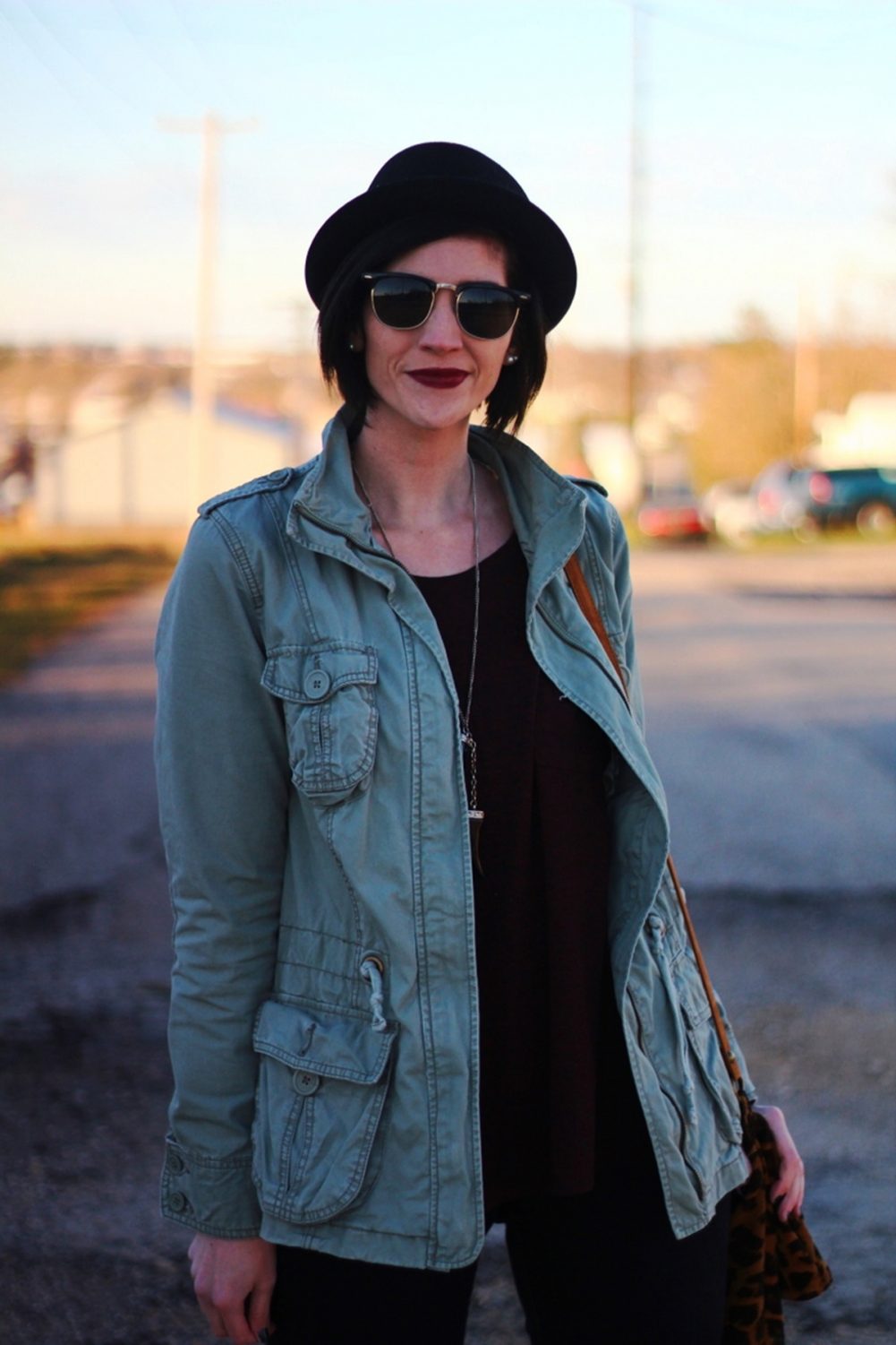 Outfit: burgundy top, burgundy lipstick, olive colored jacket, black sunglasses, pork pie hat