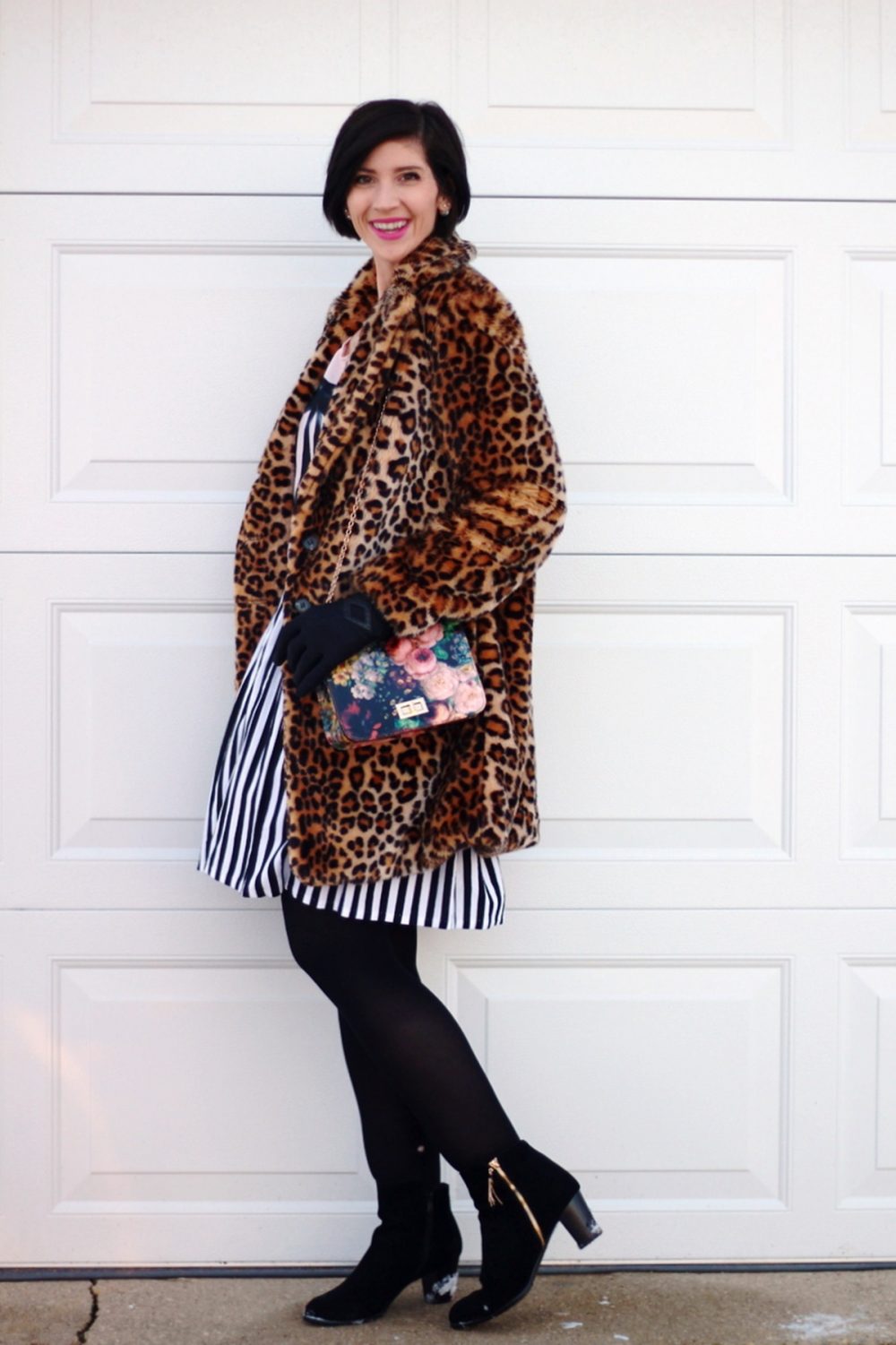 Outfit: leopard print coat, cool enamel pins, graphic bow tee, black and white striped skirt, black tights, black booties, floral print purse