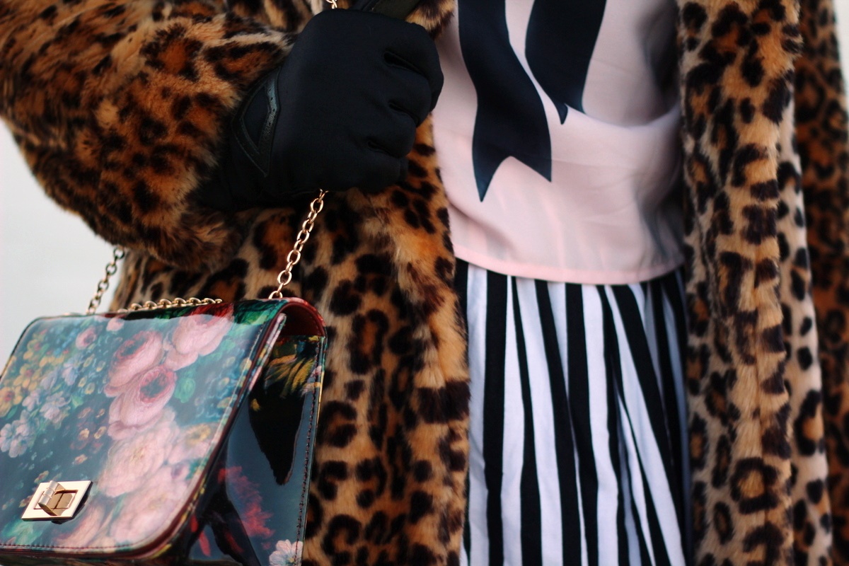 Outfit: leopard print coat, graphic bow tee, black and white striped skirt, floral print purse
