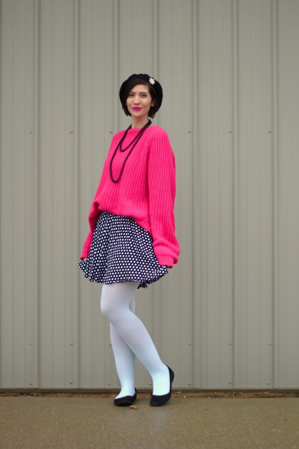 Oversized pink sweater, vintage beaded necklace, black beret, daisy pin, polka dot skirt, mint blue tights, black flats