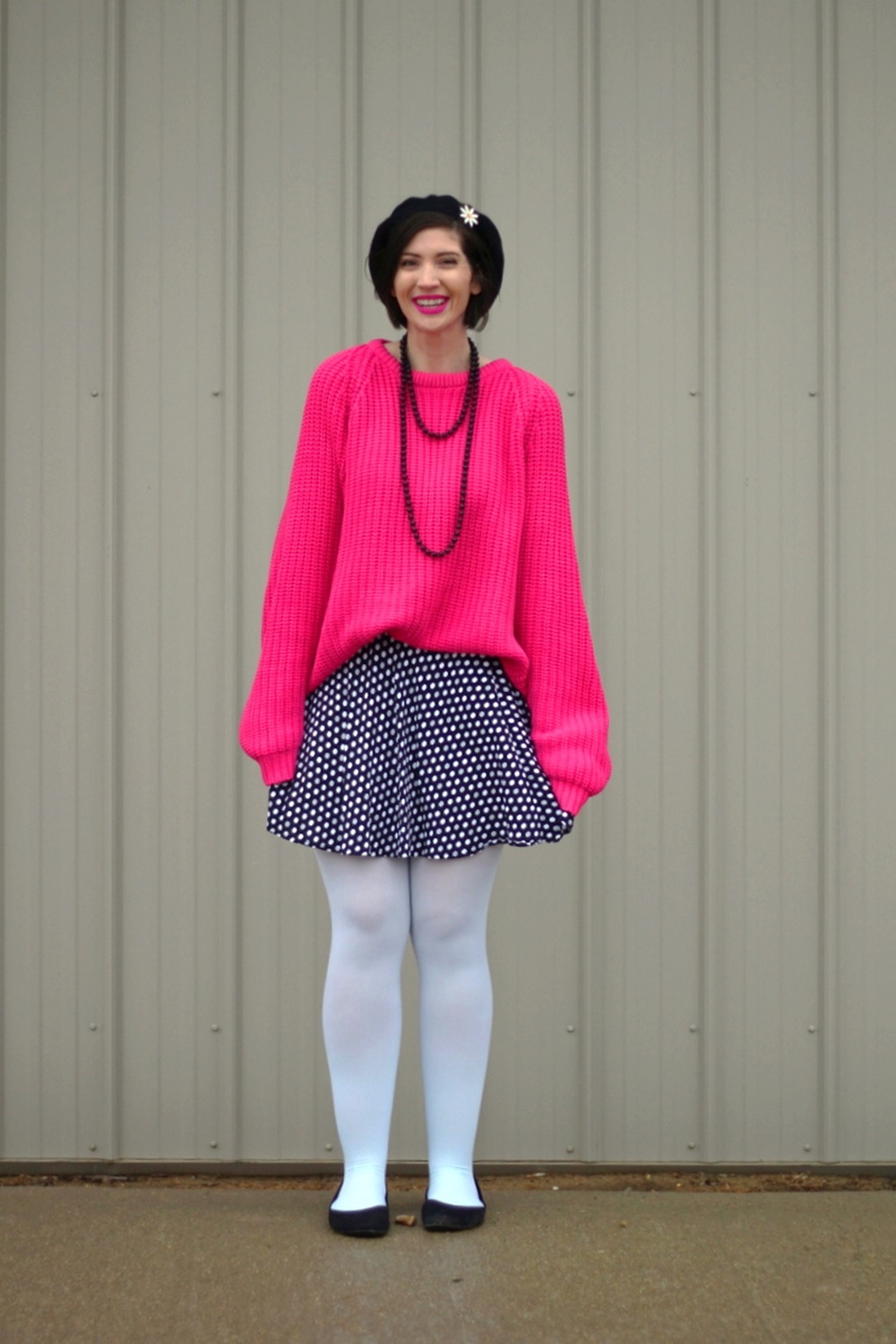 Oversized pink sweater, vintage beaded necklace, black beret, daisy pin, polka dot skirt, mint blue tights, black flats