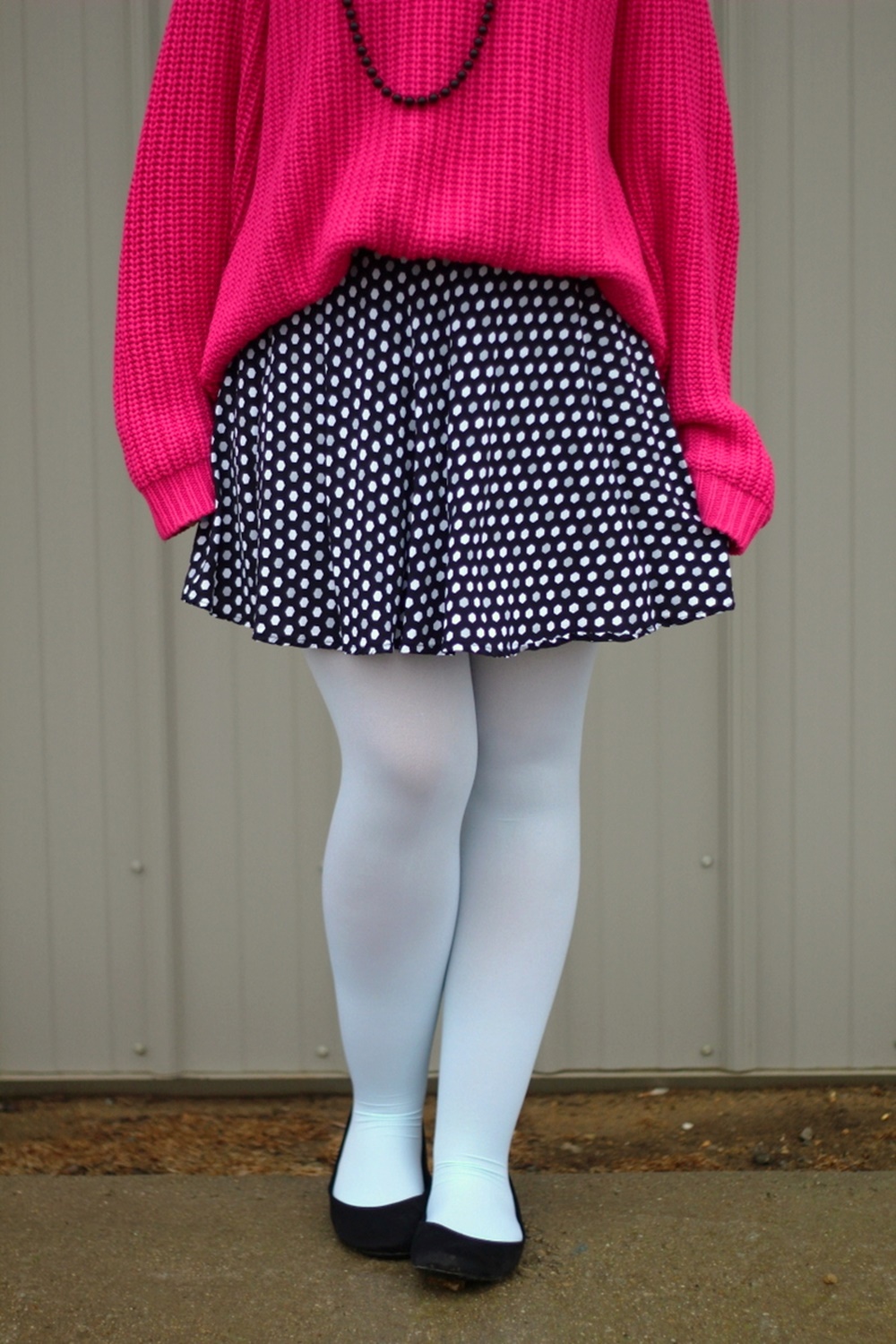 Oversized pink sweater, polka dot skirt, mint blue tights, black flats