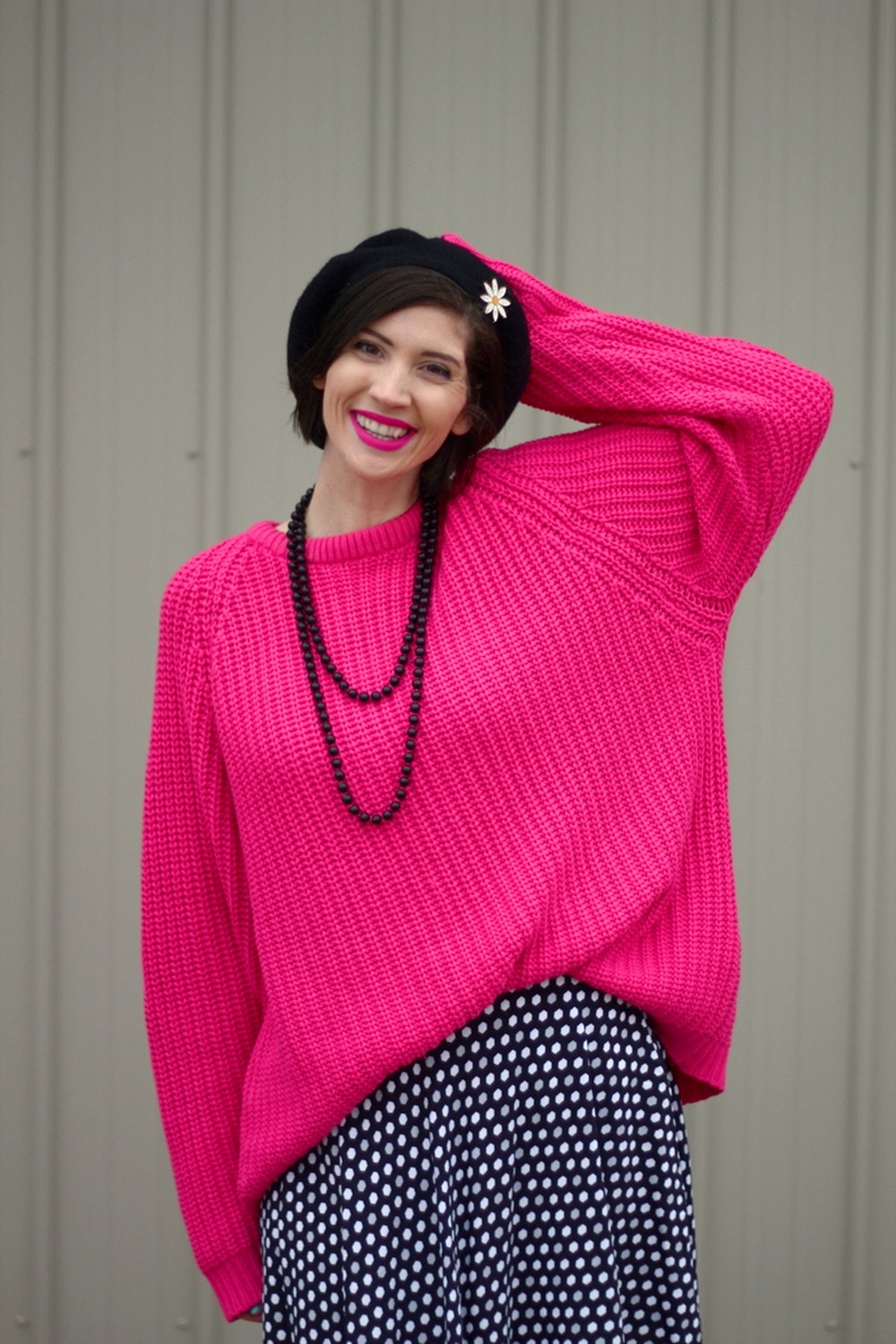 Oversized pink sweater, vintage beaded necklace, black beret, daisy pin, polka dot skirt, mint blue tights, black flats