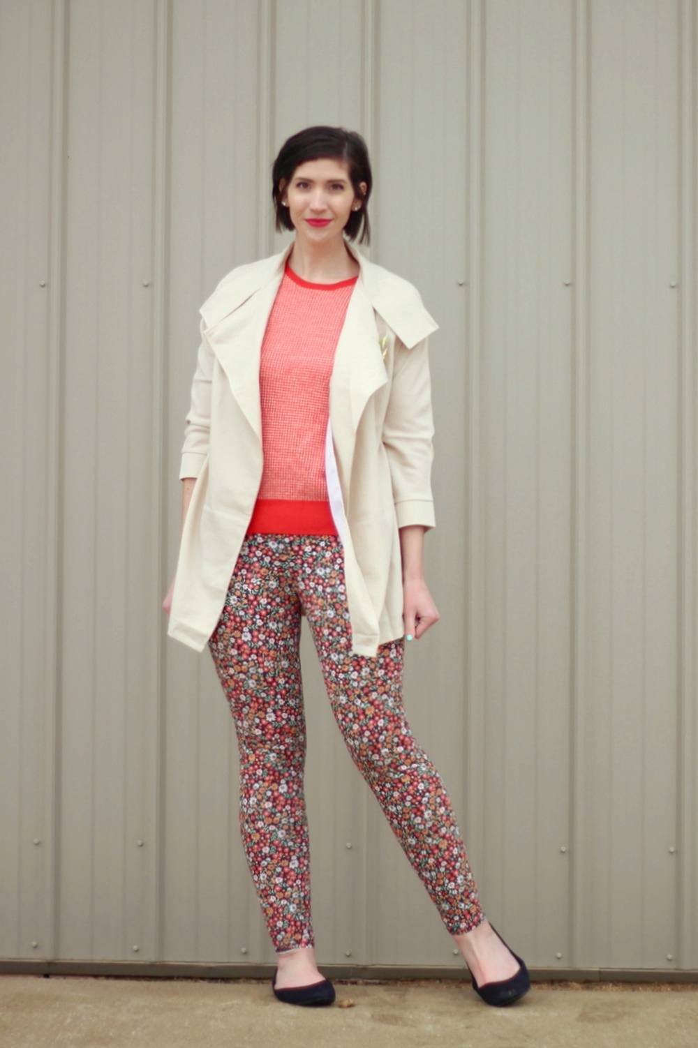 pattern mixing, orange sweater, floral pants, 1980s trench coat, vintage style, outfit